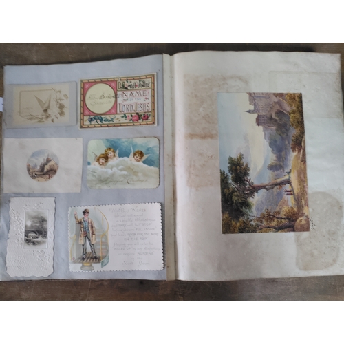 267 - A Victorian to Edwardian album of postcards, greetings cards and photographs.