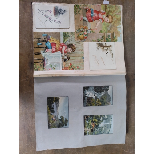 267 - A Victorian to Edwardian album of postcards, greetings cards and photographs.