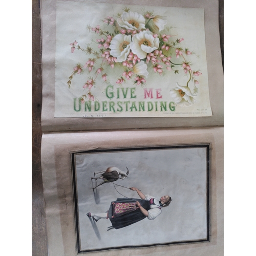 267 - A Victorian to Edwardian album of postcards, greetings cards and photographs.