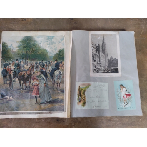 267 - A Victorian to Edwardian album of postcards, greetings cards and photographs.