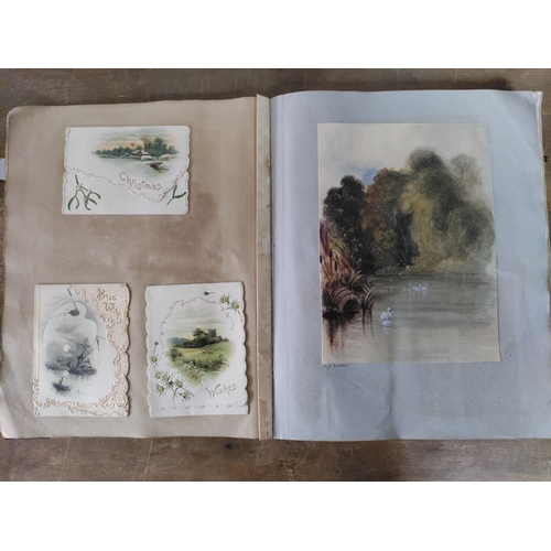 267 - A Victorian to Edwardian album of postcards, greetings cards and photographs.