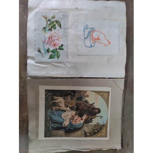 267 - A Victorian to Edwardian album of postcards, greetings cards and photographs.