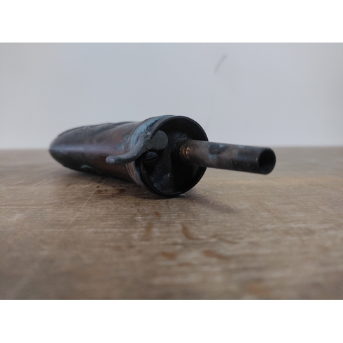 268 - A brass embossed gunpowder flask depicting 2 birds and a running dog