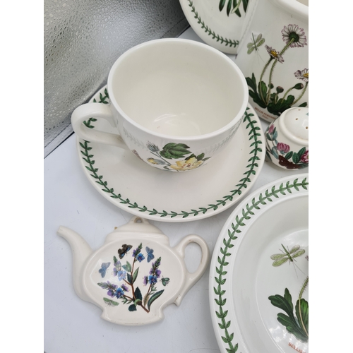 223 - A collection of 18 pieces of PortMeirion 'The Botanic Garden' crockery to include: a clock; 2 large ... 