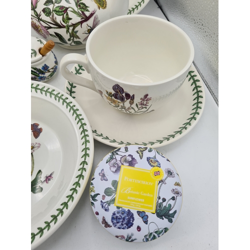 223 - A collection of 18 pieces of PortMeirion 'The Botanic Garden' crockery to include: a clock; 2 large ... 