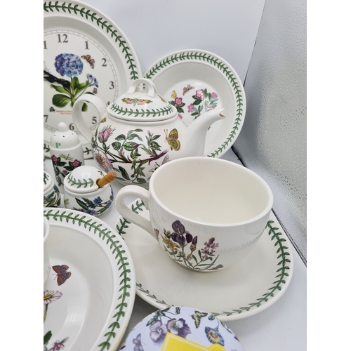 223 - A collection of 18 pieces of PortMeirion 'The Botanic Garden' crockery to include: a clock; 2 large ... 