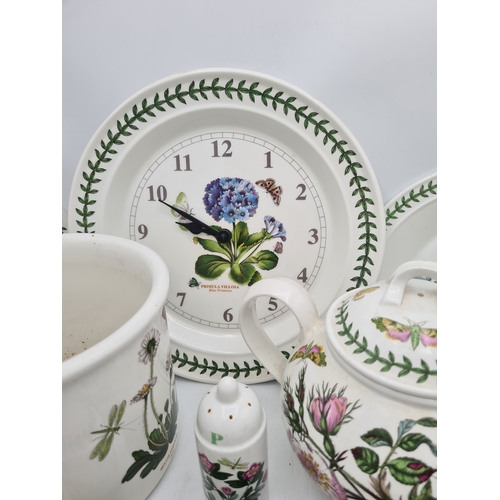 223 - A collection of 18 pieces of PortMeirion 'The Botanic Garden' crockery to include: a clock; 2 large ... 