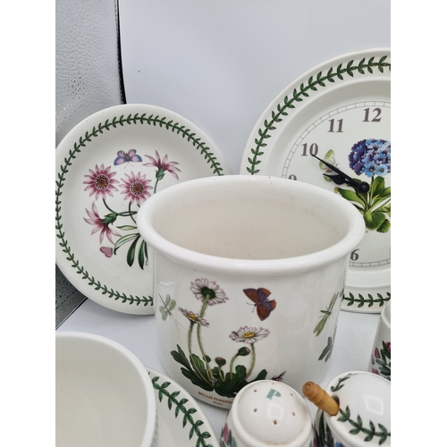 223 - A collection of 18 pieces of PortMeirion 'The Botanic Garden' crockery to include: a clock; 2 large ... 