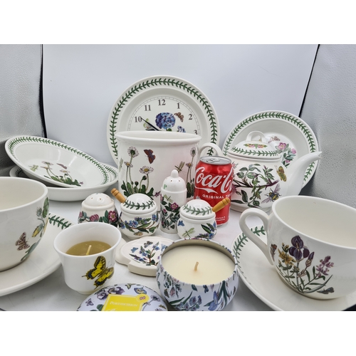 223 - A collection of 18 pieces of PortMeirion 'The Botanic Garden' crockery to include: a clock; 2 large ... 