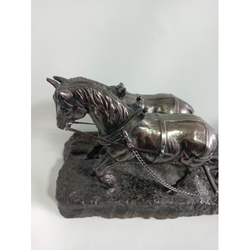 230 - A cold cast bronze sculpture of a ploughman with his horses. A few small repairs to the plough.
