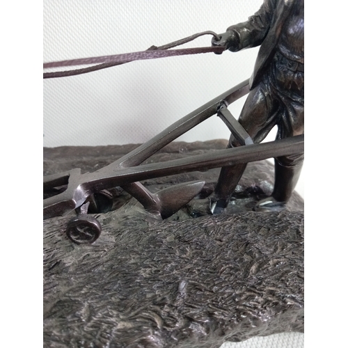 230 - A cold cast bronze sculpture of a ploughman with his horses. A few small repairs to the plough.