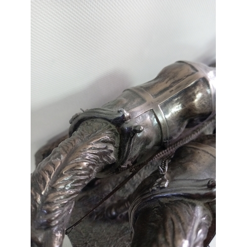 230 - A cold cast bronze sculpture of a ploughman with his horses. A few small repairs to the plough.