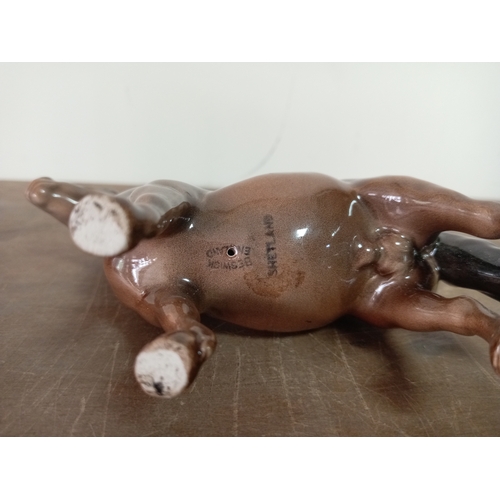 237 - A Beswick ceramic shetland pony statue marked Shetland. Model 1945