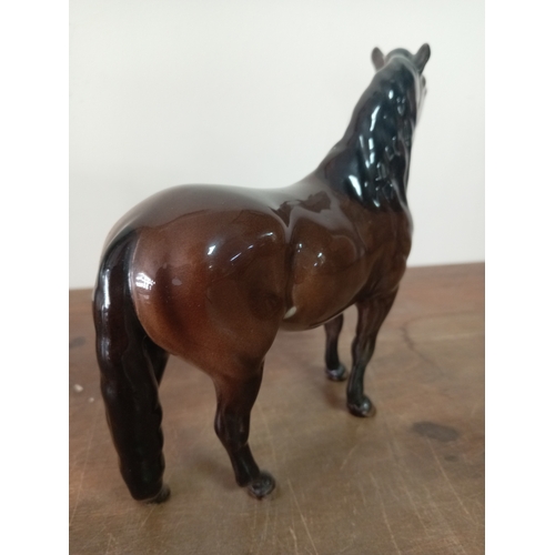 239 - A Beswick ceramic horse statue marked exmoor. Model number 1645