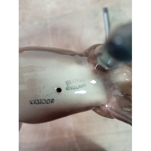 239 - A Beswick ceramic horse statue marked exmoor. Model number 1645