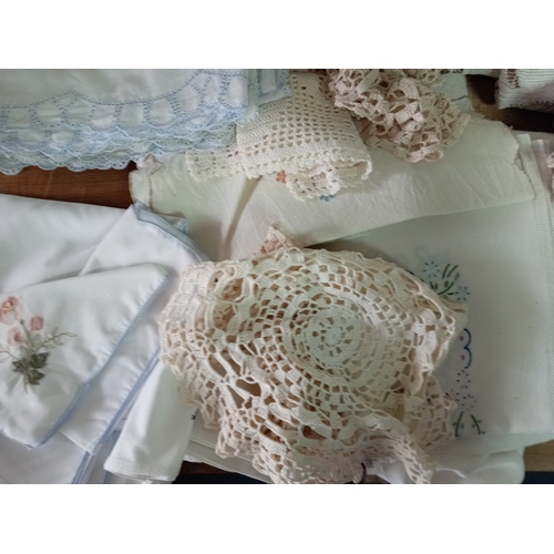 242 - A job lot of vintage embroided linen.