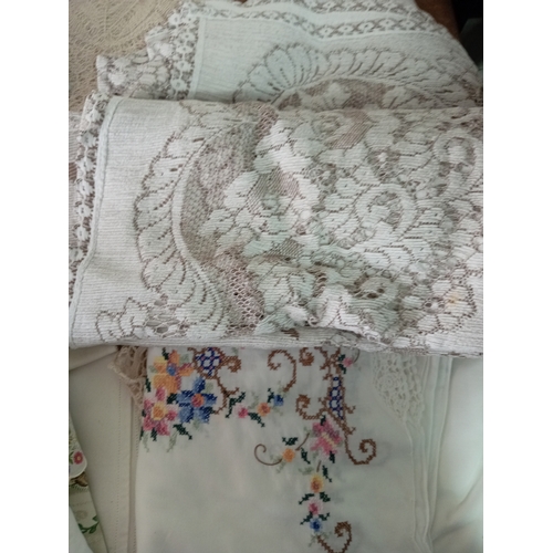 242 - A job lot of vintage embroided linen.