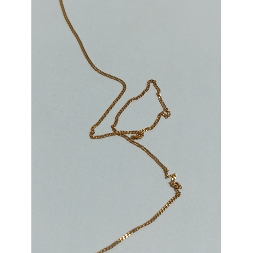 322 - A 9ct gold fish pendant and a broken 9ct gold chain. Weight 1.7g