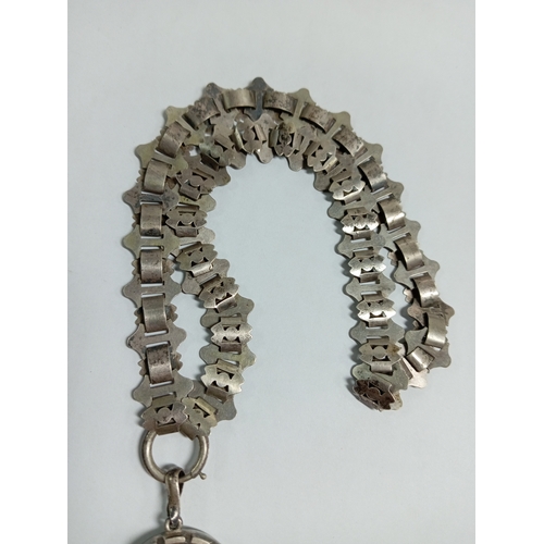 328 - An antique Victorian collar necklace and pendant engraved with a bird and floral patterns. Length 20... 