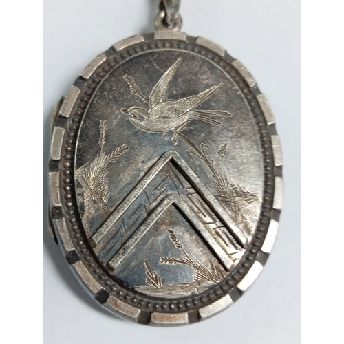 328 - An antique Victorian collar necklace and pendant engraved with a bird and floral patterns. Length 20... 