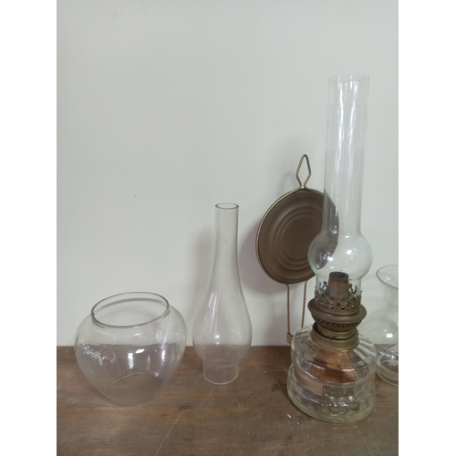 9 - Vintage Clear Glass Oil Lamp With Ornate Base Including An Assortment Of Glass Lamp shades and chimn... 