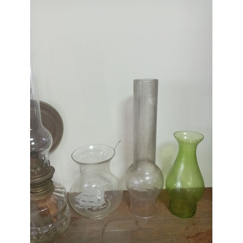 9 - Vintage Clear Glass Oil Lamp With Ornate Base Including An Assortment Of Glass Lamp shades and chimn... 