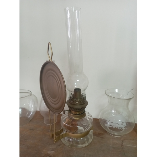 9 - Vintage Clear Glass Oil Lamp With Ornate Base Including An Assortment Of Glass Lamp shades and chimn... 