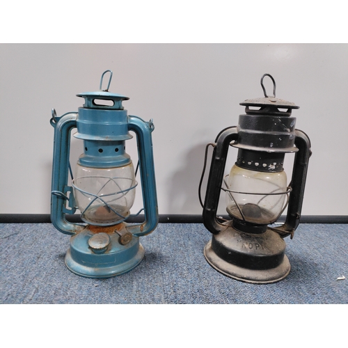 36 - A collection of 2 Tilley paraffin lamps, A vintage real hide triple hip flask, & A Sony portable rad... 