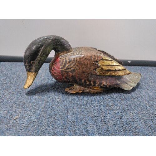 38 - A trio of decorative ducks, one wood & two believed to be stone. One duck has had a beak repair.