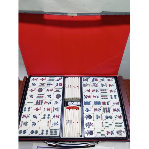 50 - A complete Mah-Jongg set to include chips and carry case, dice, score counter, instructions and piec... 