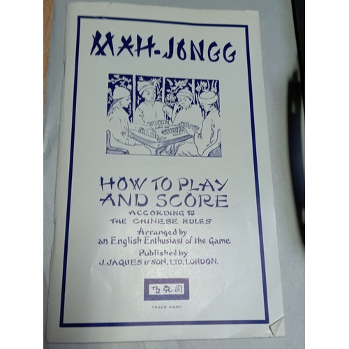50 - A complete Mah-Jongg set to include chips and carry case, dice, score counter, instructions and piec... 