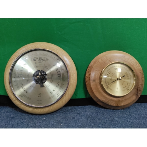 53 - A pair of wooden barometers