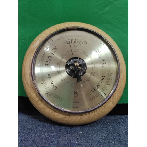 53 - A pair of wooden barometers