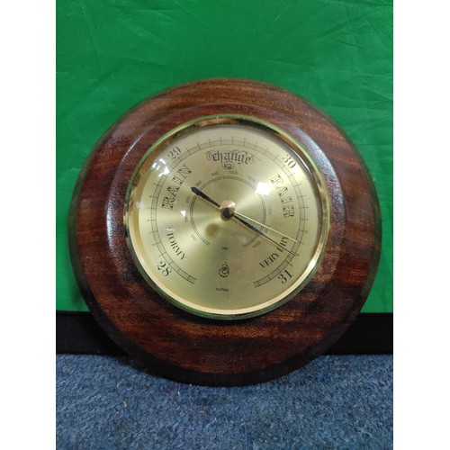 55 - A pair of wooden barometers.