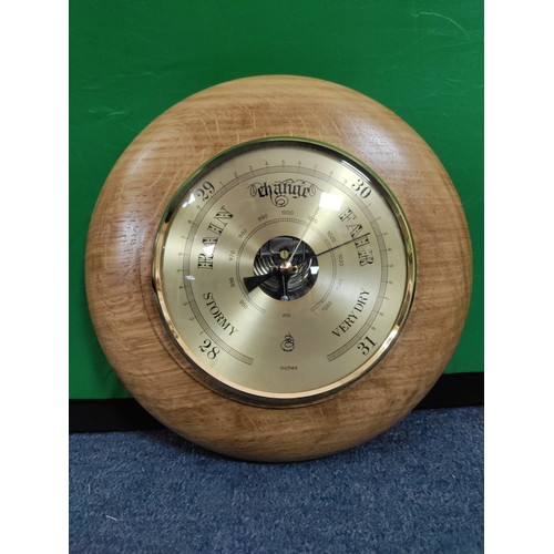 55 - A pair of wooden barometers.