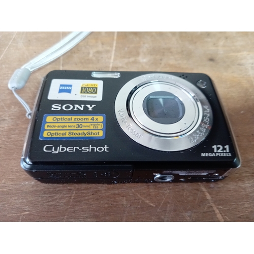 57 - A collection of cameras and equipment to include an olympia DL3000R new in the box, Two Canon EOS 10... 