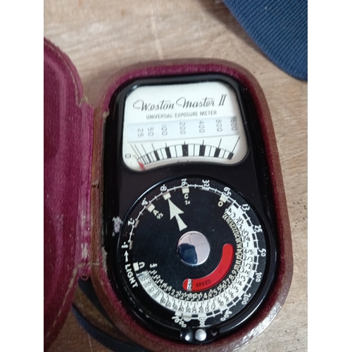 57 - A collection of cameras and equipment to include an olympia DL3000R new in the box, Two Canon EOS 10... 