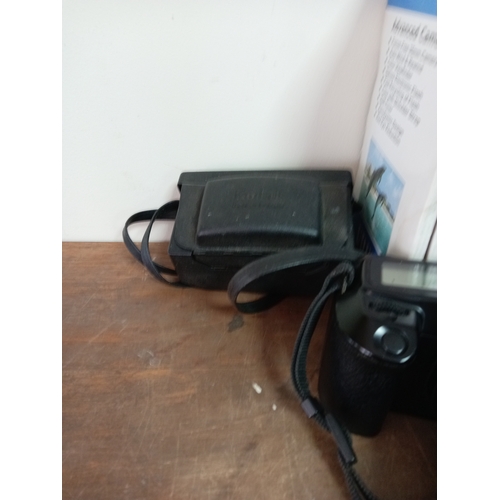 57 - A collection of cameras and equipment to include an olympia DL3000R new in the box, Two Canon EOS 10... 