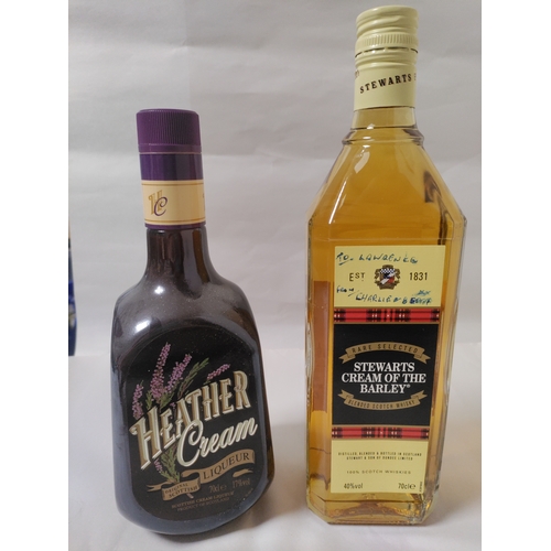 252 - Two bottles of alcohol, to include; a bottle of Heather Cream Liqueur (Scotland), and a bottle of St... 
