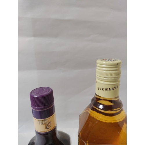 252 - Two bottles of alcohol, to include; a bottle of Heather Cream Liqueur (Scotland), and a bottle of St... 