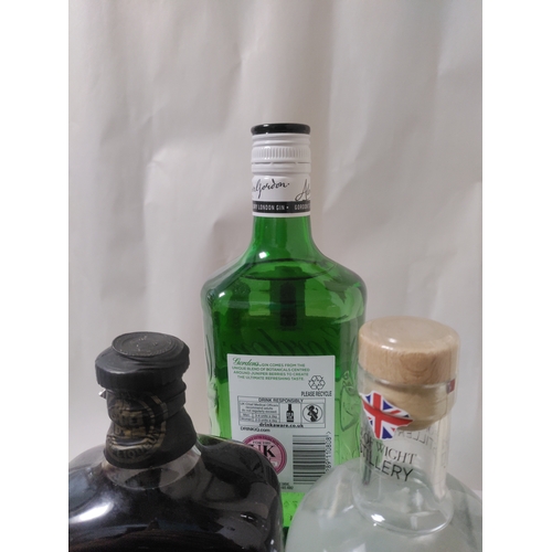 265 - Three bottles of Gin and Liqueur, to include; One bottle of Moniack Sloe Liqueur, one bottle of HMS ... 