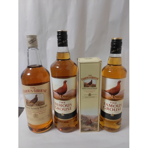 268 - Four bottles of 'The Famous Grouse' Scotch Whisky; Two 1 L bottles, one 35 cl bottle (boxed), and on... 