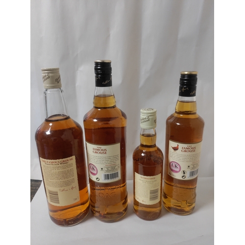 268 - Four bottles of 'The Famous Grouse' Scotch Whisky; Two 1 L bottles, one 35 cl bottle (boxed), and on... 