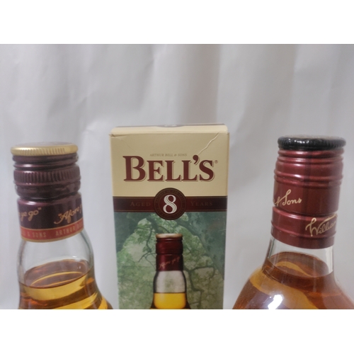 269 - Three bottles of Blended Scotch Whisky, to include; One Bell's Original (unboxed) , one Bell's Aged ... 