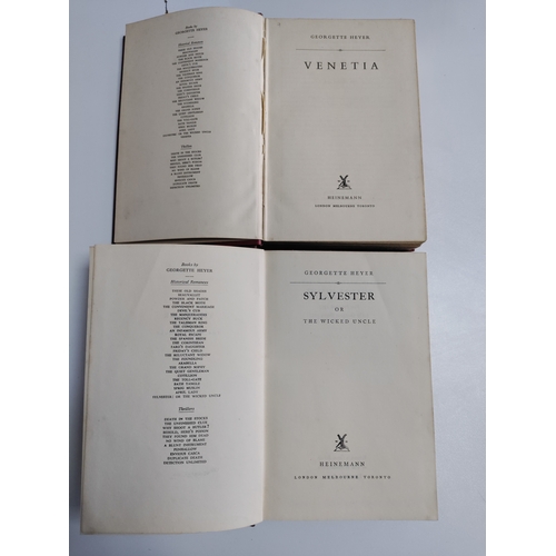 212 - A pair of Georgette Heyer books. One is Sylvester 1957 and Venetia 1958.