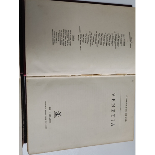 212 - A pair of Georgette Heyer books. One is Sylvester 1957 and Venetia 1958.