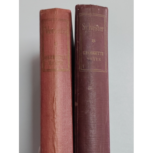 212 - A pair of Georgette Heyer books. One is Sylvester 1957 and Venetia 1958.