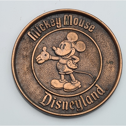 6 - A set of 7 vintage Mickey Mouse Disneyland Brass coloured metal coasters. Made by Century of Canada.... 