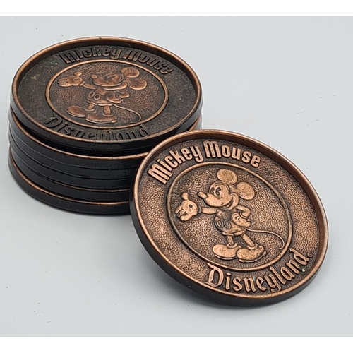 6 - A set of 7 vintage Mickey Mouse Disneyland Brass coloured metal coasters. Made by Century of Canada.... 