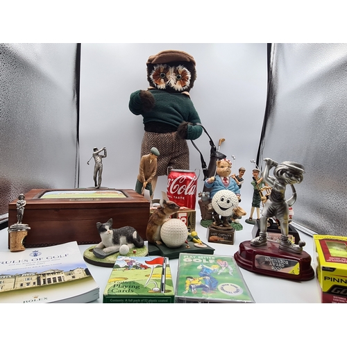 8 - A collection of Golf related memorabilia to include trophy's; ornaments, a golfing Owl, a St Andrews... 